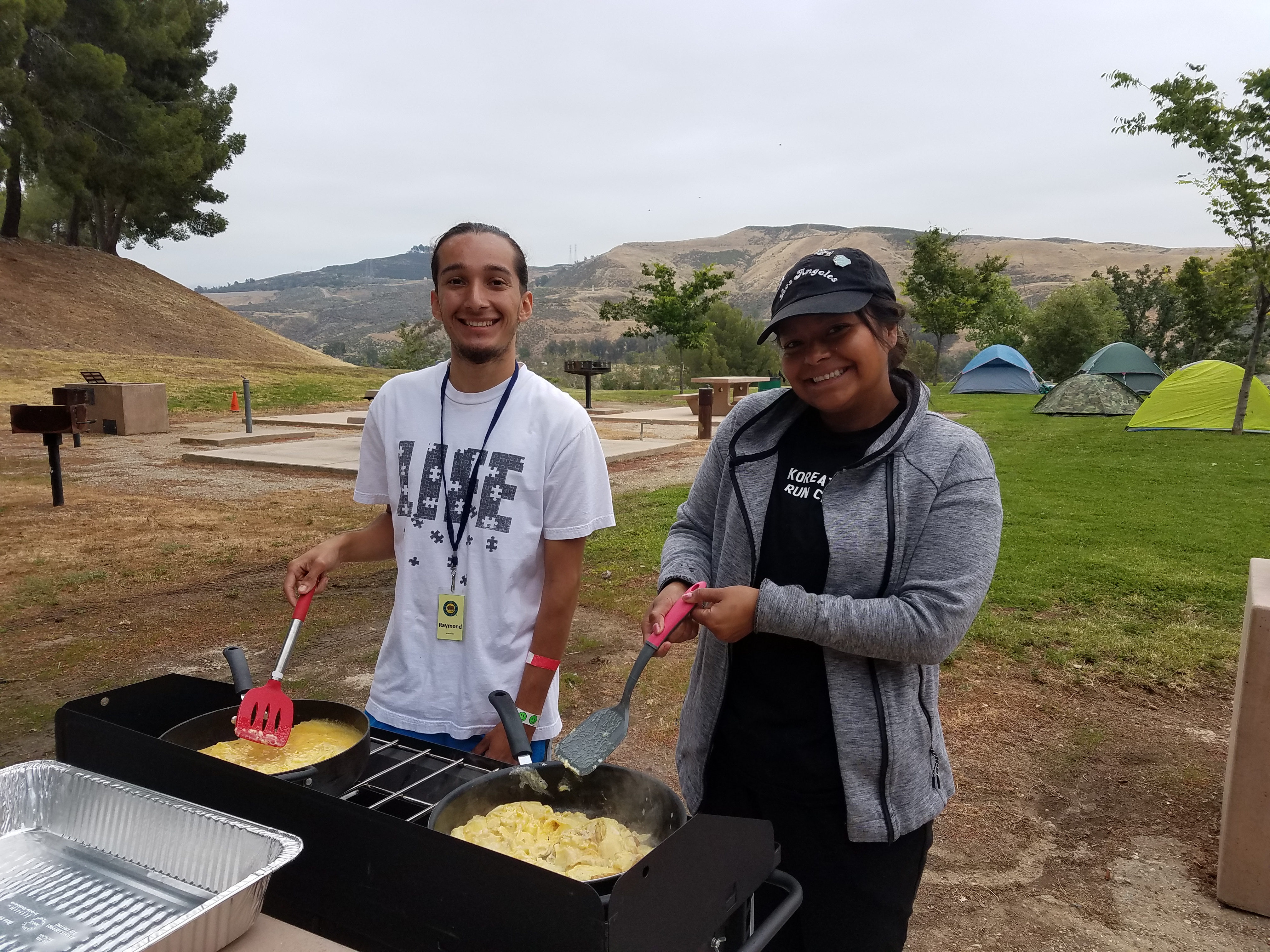 two people cooking